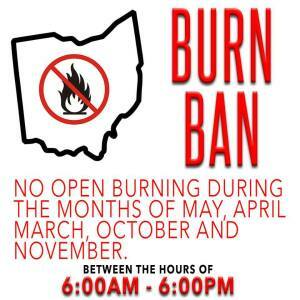 Image of a burn ban notice. Shows a crossed-out fire icon inside an outline of Ohio. Text states: "No open burning during the months of May, April, March, October, and November, between the hours of 6:00 AM - 6:00 PM.